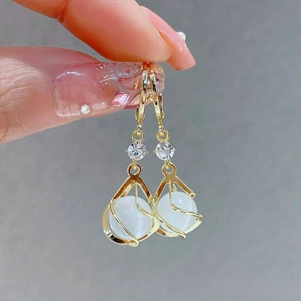 Old white opal dangle earrings in gold